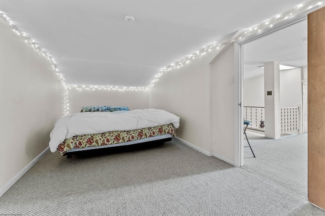 bedroom featuring carpet flooring and baseboards