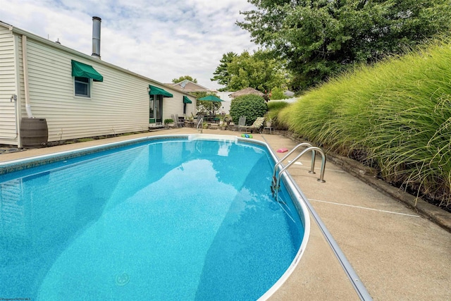 outdoor pool with a patio