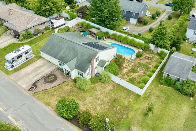 birds eye view of property with a residential view