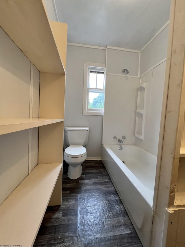 full bath featuring toilet, baseboards, and wood finished floors