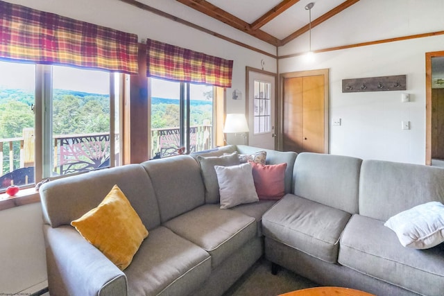 living room with vaulted ceiling with beams and a mountain view