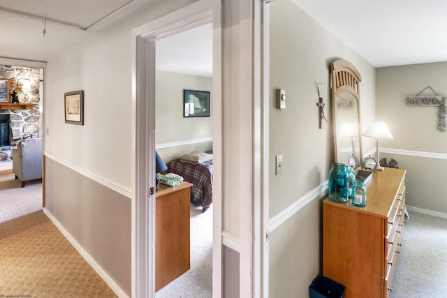 corridor featuring light colored carpet