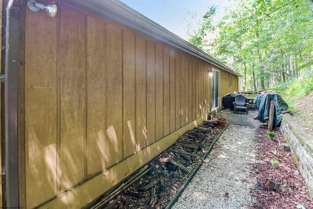 view of property exterior with a patio area