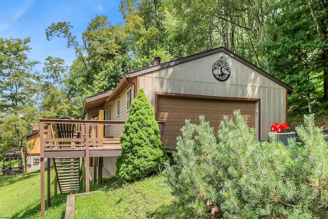 exterior space with a garage and a yard