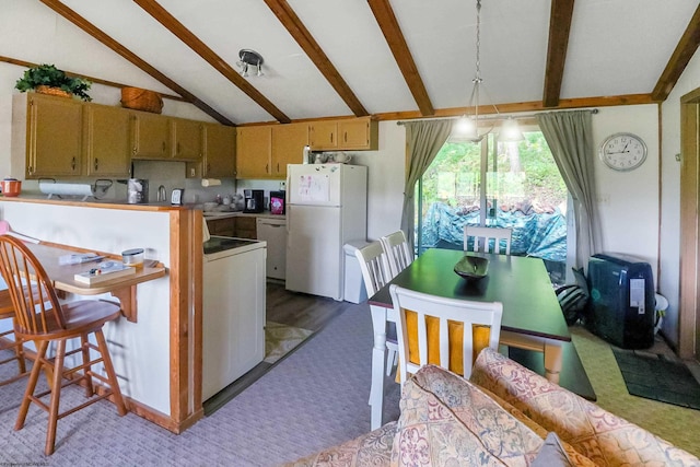 kitchen featuring carpet floors, white appliances, and vaulted ceiling with beams