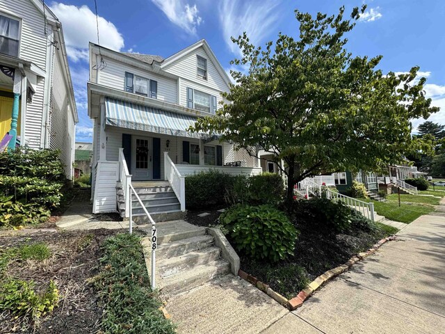 townhome / multi-family property with a porch