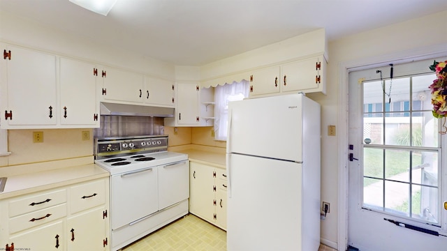 kitchen with white appliances, white cabinets, decorative backsplash, and light tile patterned floors