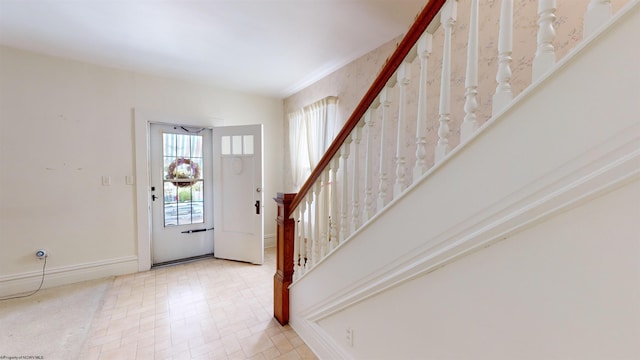 foyer entrance with a wealth of natural light