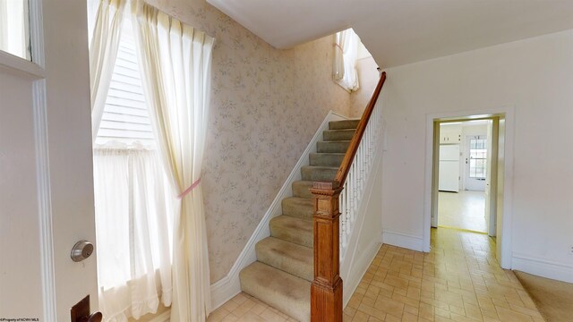 staircase with tile patterned flooring