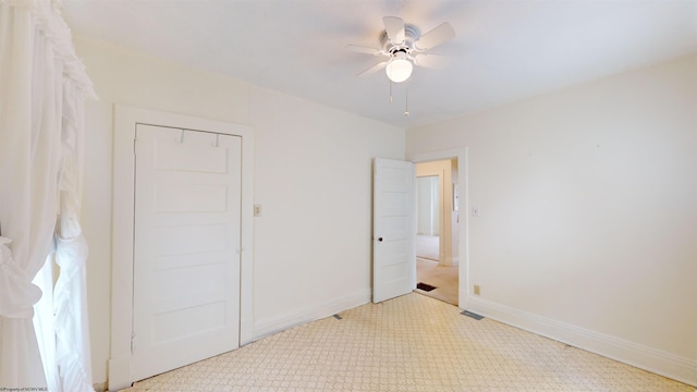 unfurnished bedroom featuring ceiling fan