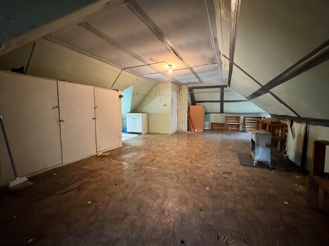 additional living space featuring lofted ceiling