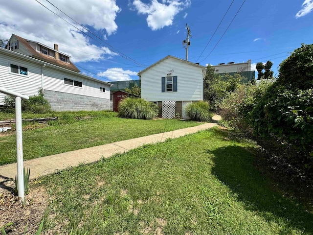 view of property exterior featuring a lawn