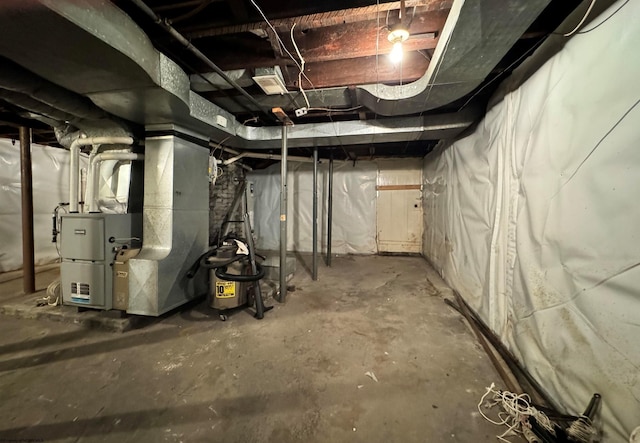 basement featuring heating unit