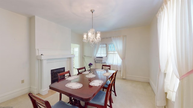 dining space featuring cooling unit, light colored carpet, and an inviting chandelier