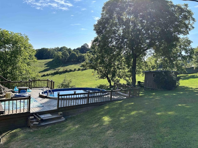 view of yard with an outdoor pool and a deck