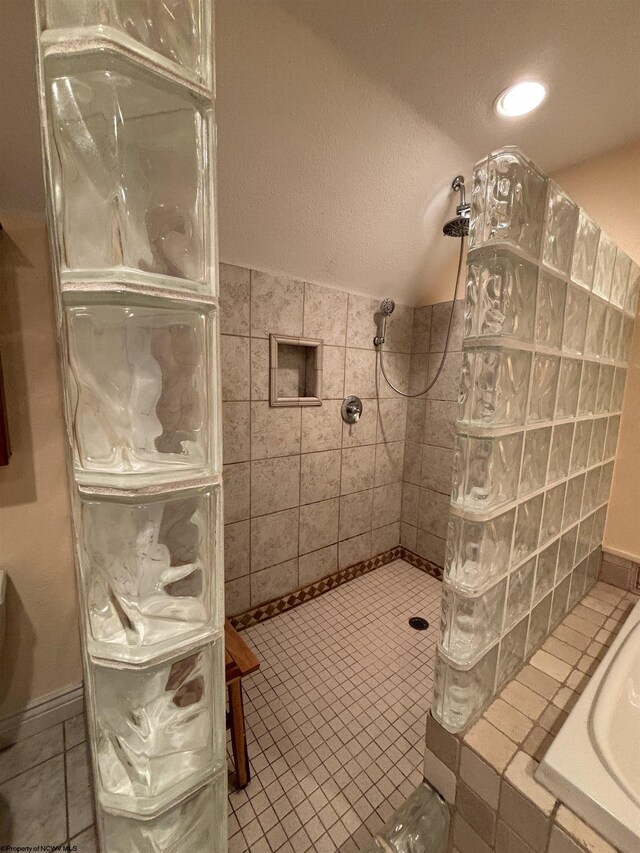 bathroom with tile patterned flooring and independent shower and bath