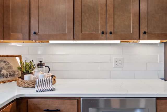 room details with backsplash and light stone counters