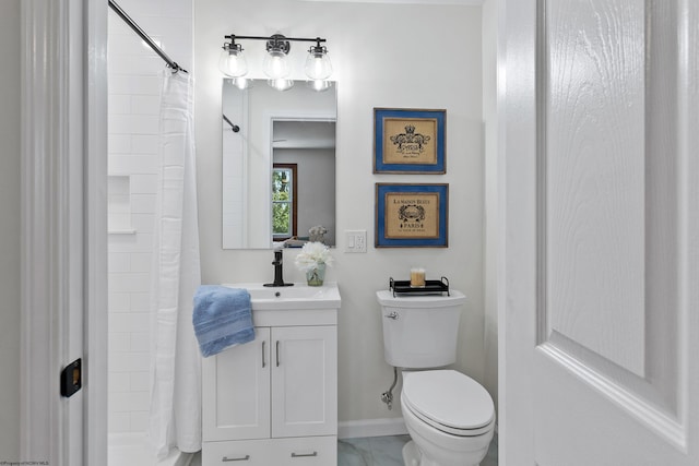 bathroom with tile patterned floors, vanity, and toilet