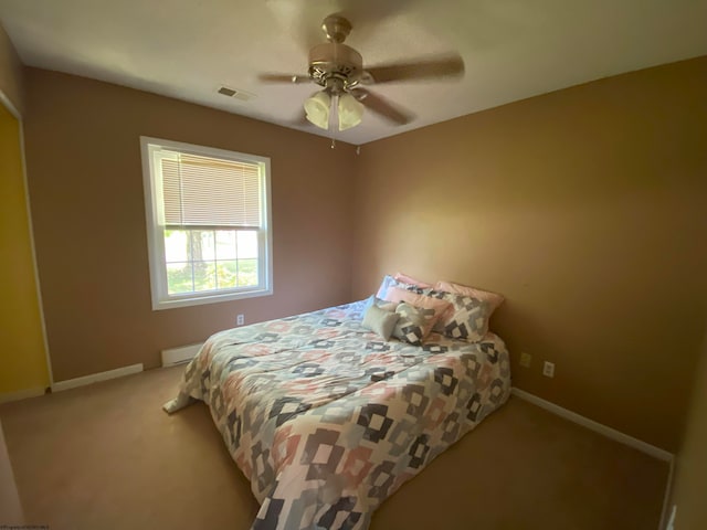 bedroom featuring ceiling fan and light colored carpet