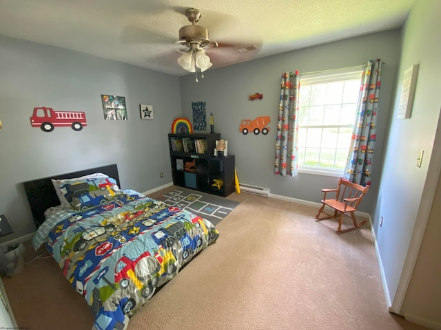 bedroom with a baseboard heating unit, ceiling fan, a textured ceiling, and carpet