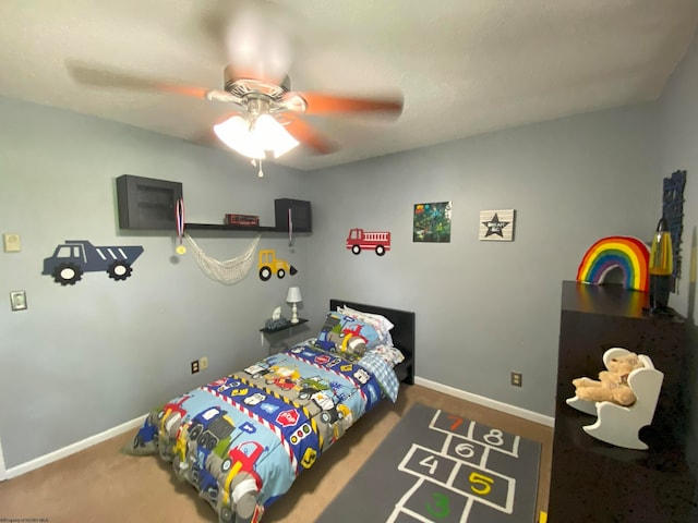 carpeted bedroom featuring ceiling fan