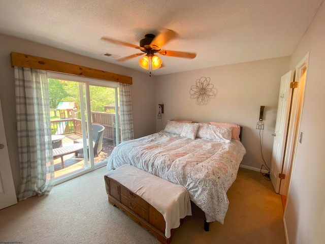 bedroom with access to outside, a textured ceiling, carpet flooring, and ceiling fan