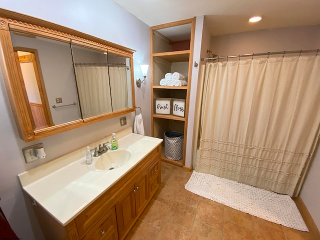 bathroom with vanity and tile patterned flooring