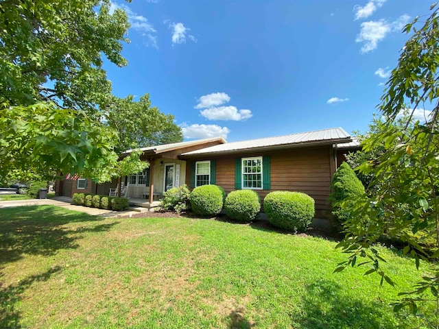 ranch-style home with a front lawn