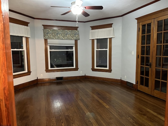 empty room featuring ceiling fan, dark hardwood / wood-style flooring, and ornamental molding