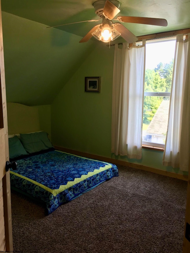 bedroom featuring carpet, ceiling fan, and vaulted ceiling