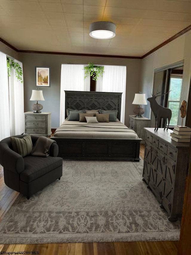 bedroom with hardwood / wood-style floors and crown molding