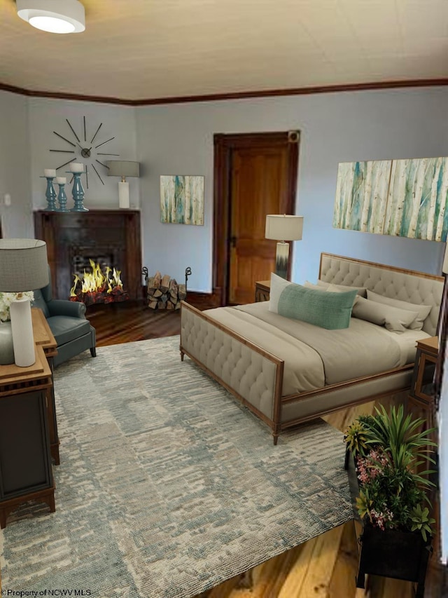 bedroom featuring hardwood / wood-style flooring and ornamental molding