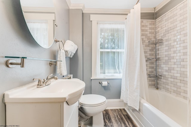 full bathroom featuring toilet, crown molding, hardwood / wood-style floors, and shower / bath combo