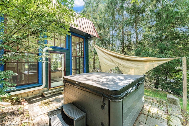 wooden deck with a hot tub