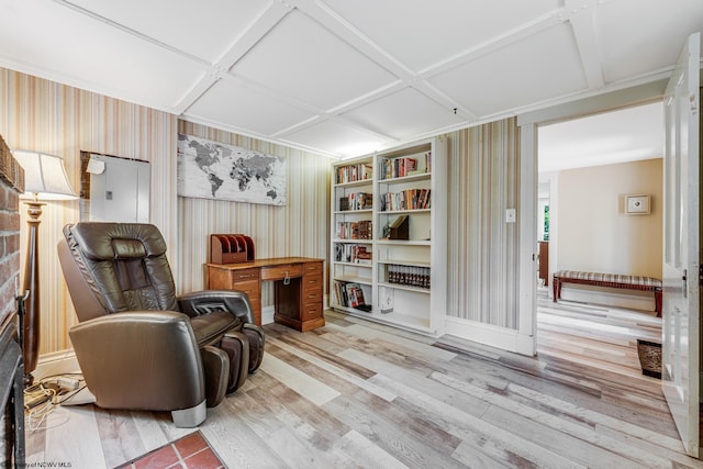 sitting room featuring hardwood / wood-style floors and coffered ceiling