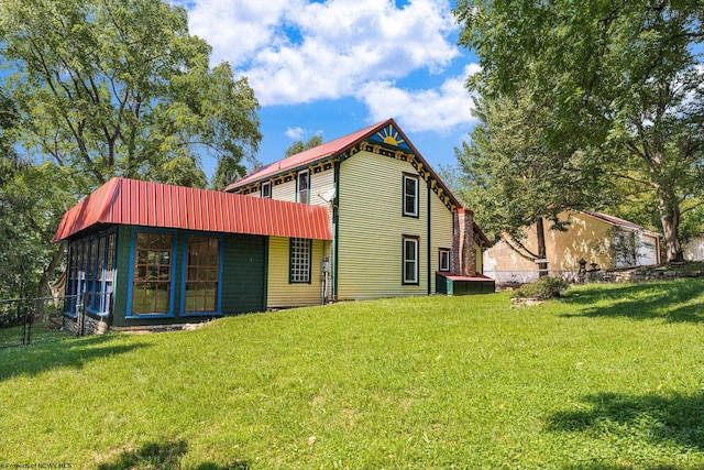 rear view of house with a lawn