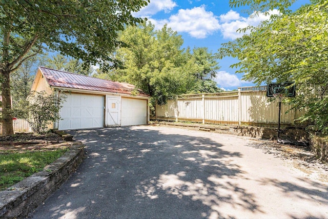 view of side of property with a garage