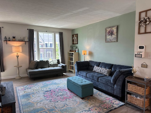 living room featuring a textured ceiling and hardwood / wood-style flooring