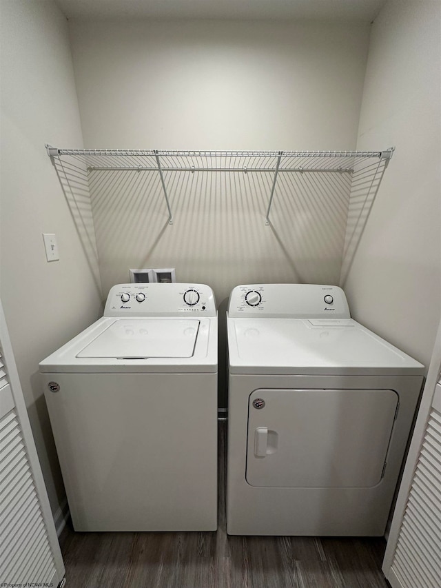 washroom with washer and dryer and dark hardwood / wood-style floors