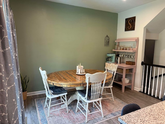 dining space featuring dark hardwood / wood-style flooring