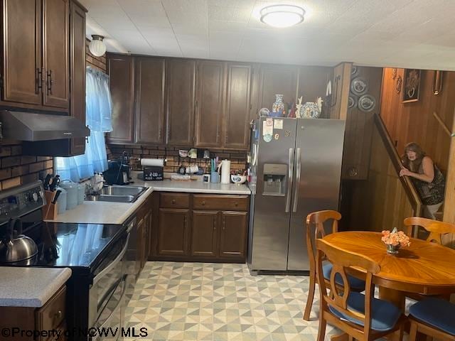 kitchen with sink, decorative backsplash, black range with electric cooktop, dark brown cabinets, and stainless steel fridge with ice dispenser