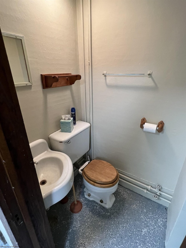 bathroom featuring a sink and toilet