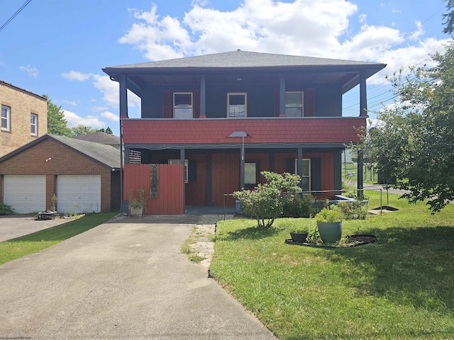 view of front facade with driveway, a shingled roof, a balcony, a front lawn, and a porch