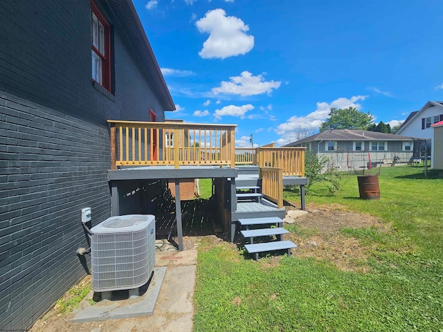 view of yard with a wooden deck and cooling unit