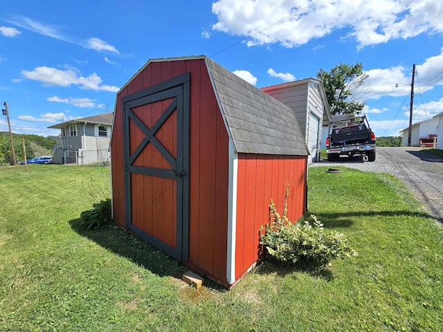 view of shed featuring driveway