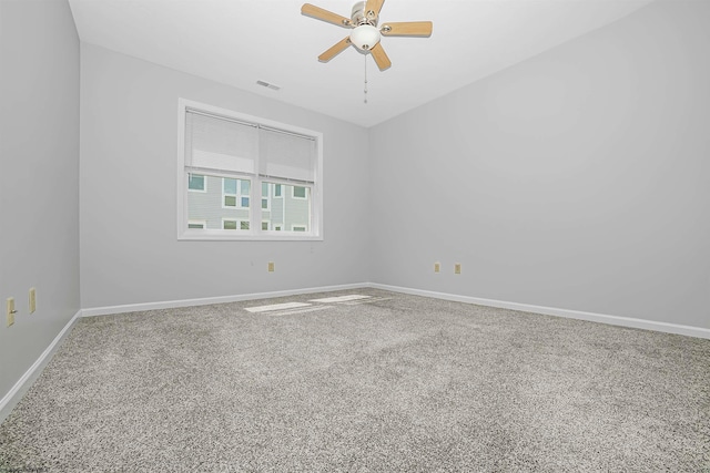 empty room with carpet flooring and ceiling fan