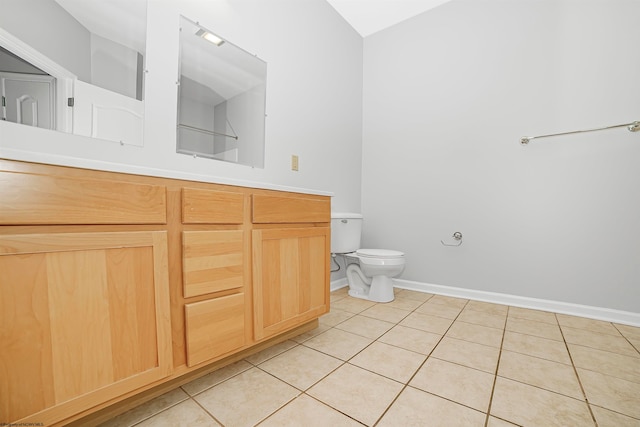 bathroom featuring tile patterned floors, vanity, and toilet