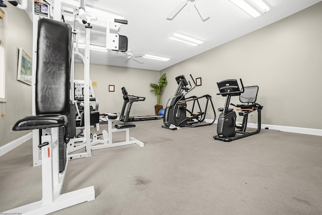 workout area with ceiling fan and baseboards