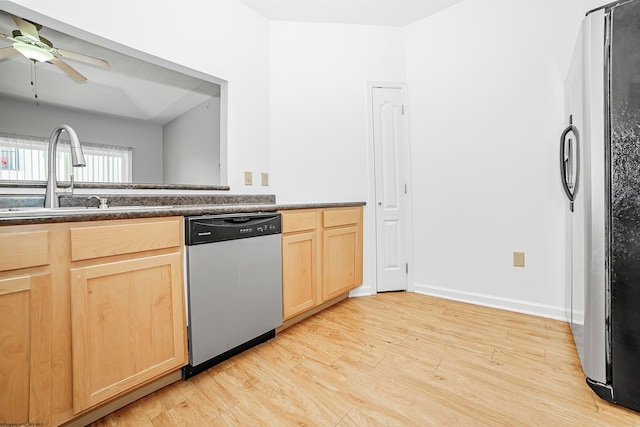 kitchen featuring ceiling fan, light wood-type flooring, light brown cabinetry, sink, and stainless steel appliances