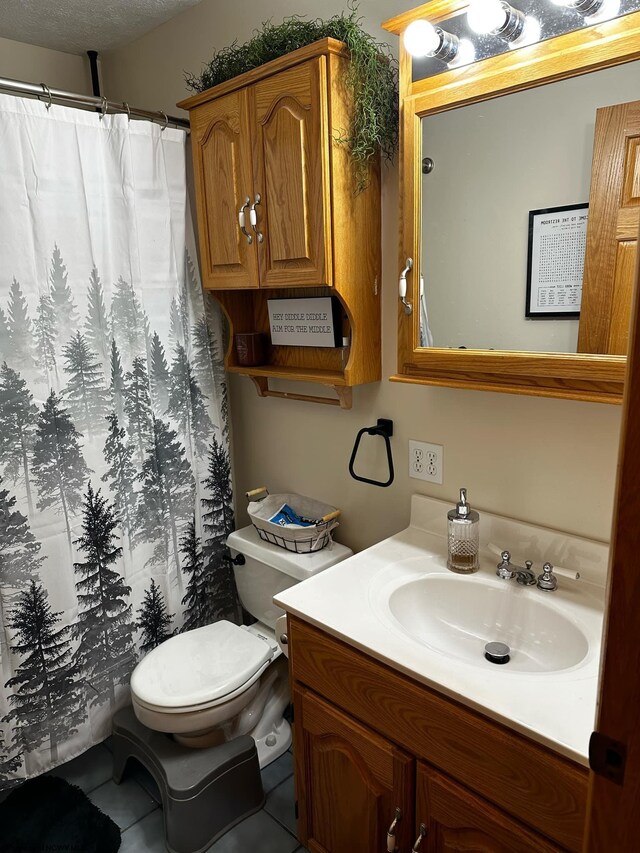 bathroom featuring vanity, tile patterned floors, a textured ceiling, toilet, and a shower with curtain